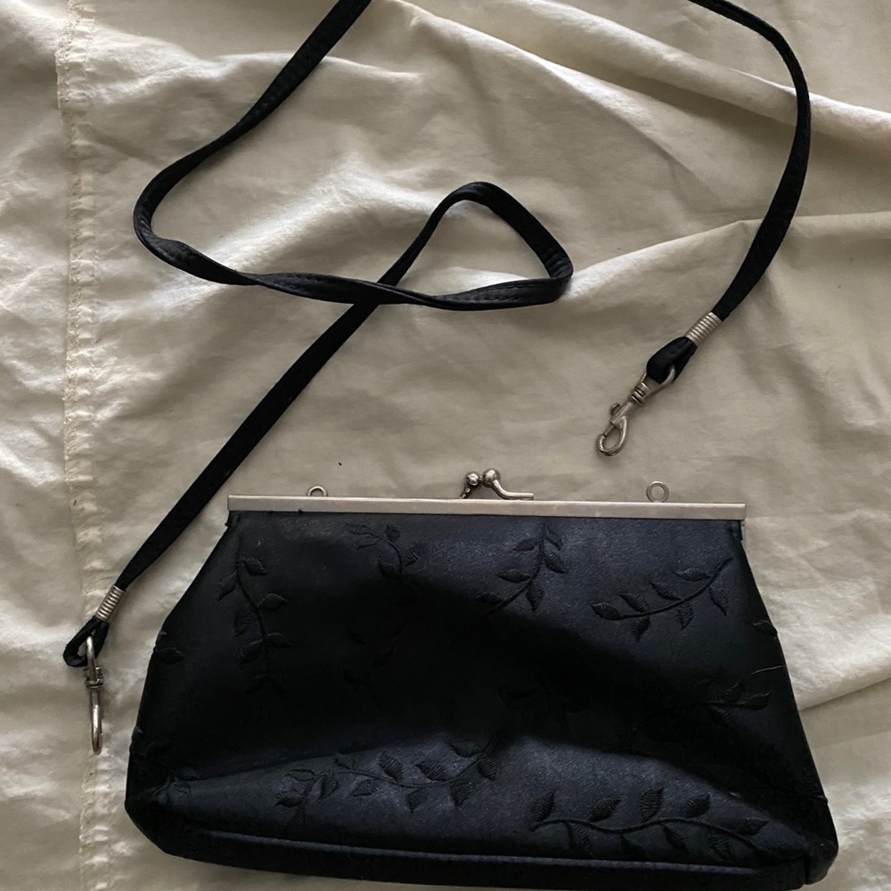Black Giannini clutch with detachable strap;